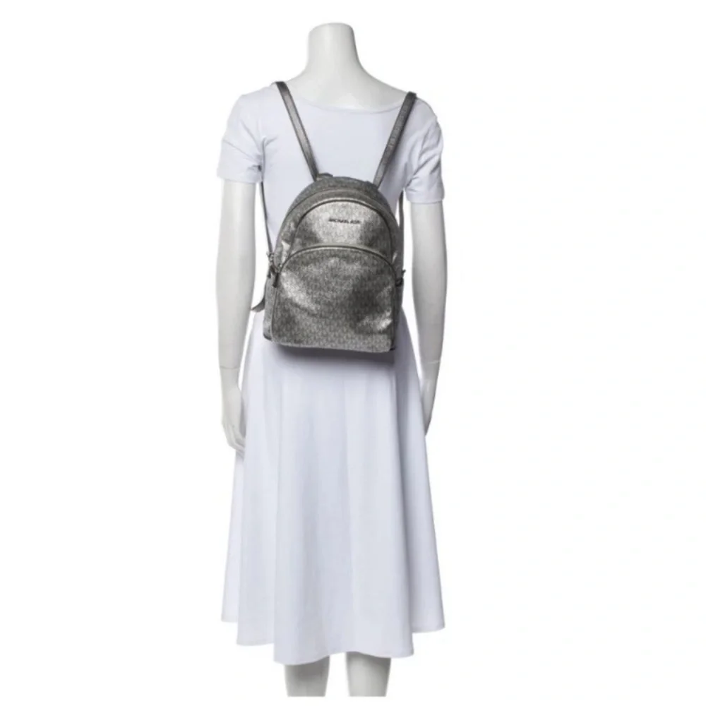 Michael Kors Silver shimmer Monogram Backpack shiny zipper leather compartments‎